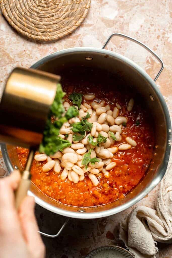Hearty quinoa vegetable soup with tomatoes, beans, and kale. Healthy, cozy, and easy to make in one pot for a nourishing meal. | aheadofthyme.com