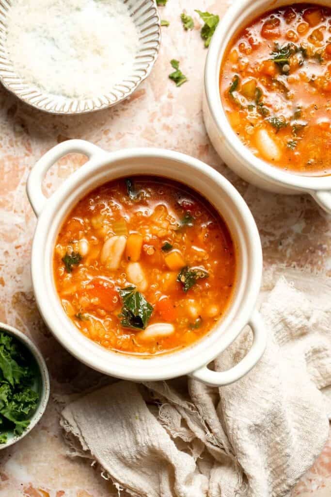 Hearty quinoa vegetable soup with tomatoes, beans, and kale. Healthy, cozy, and easy to make in one pot for a nourishing meal. | aheadofthyme.com