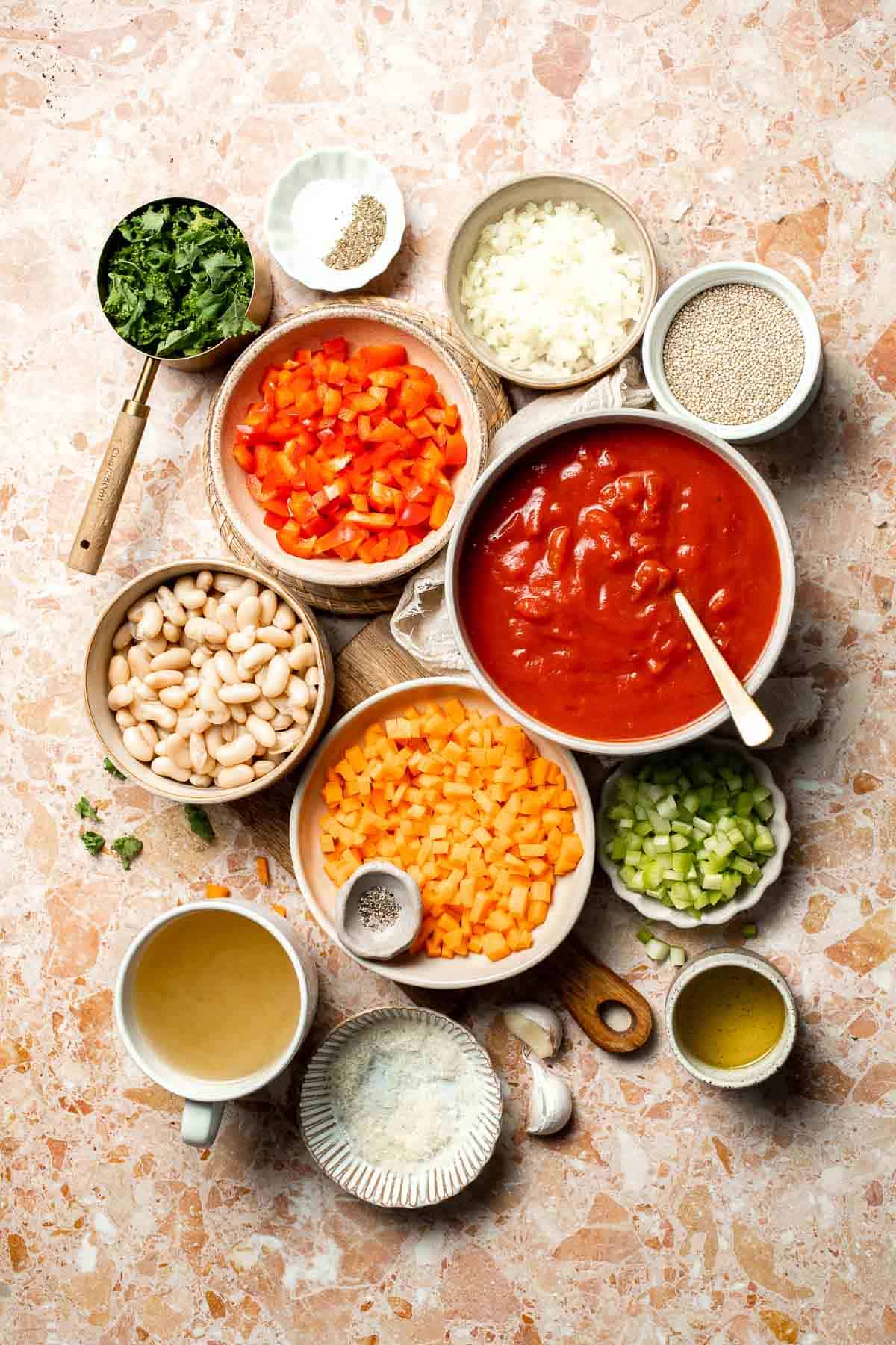 Hearty quinoa vegetable soup with tomatoes, beans, and kale. Healthy, cozy, and easy to make in one pot for a nourishing meal. | aheadofthyme.com