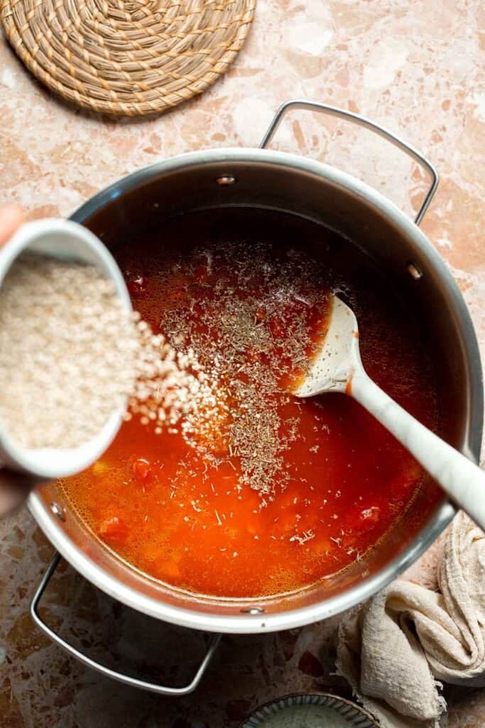 Hearty quinoa vegetable soup with tomatoes, beans, and kale. Healthy, cozy, and easy to make in one pot for a nourishing meal. | aheadofthyme.com
