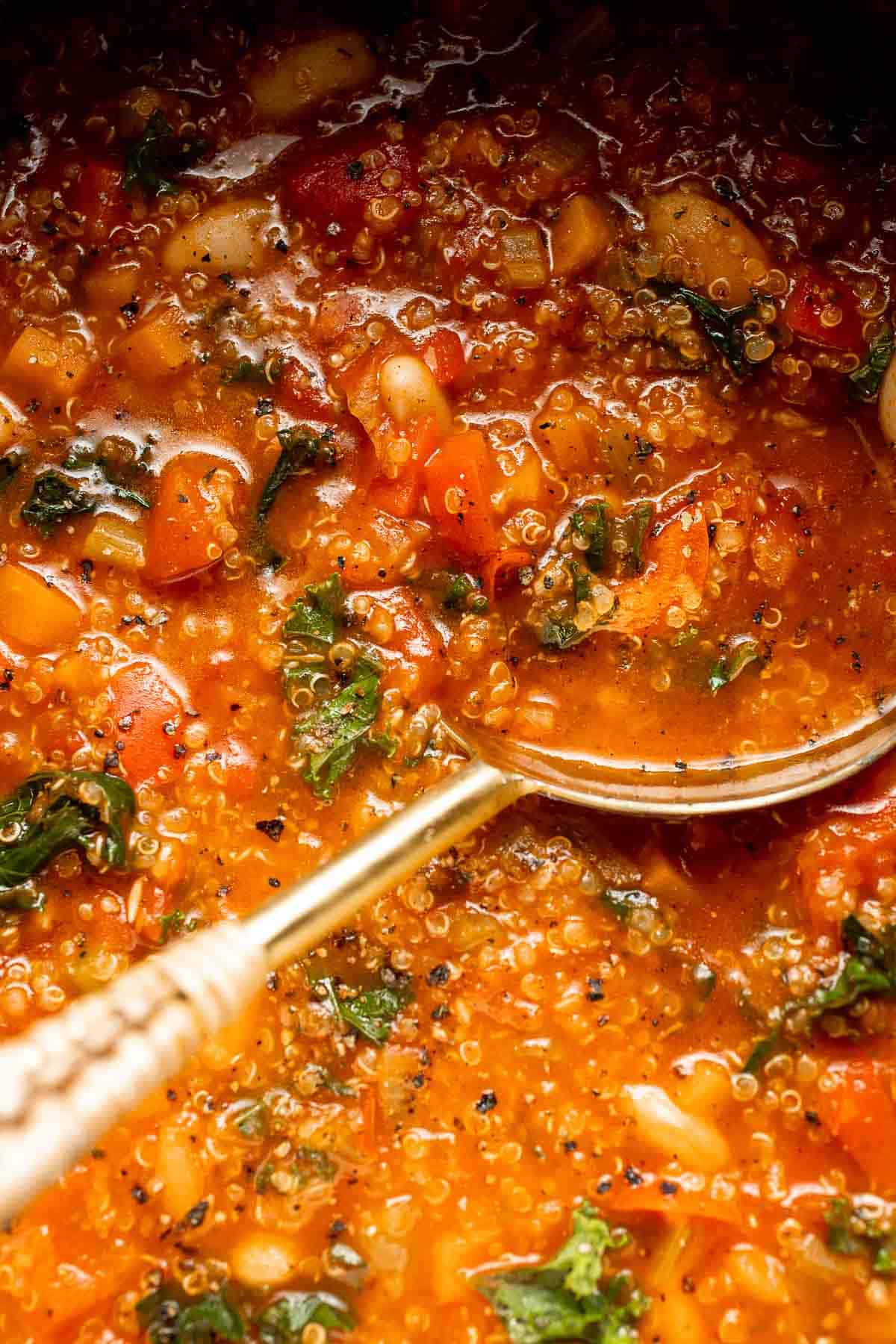 Hearty quinoa vegetable soup with tomatoes, beans, and kale. Healthy, cozy, and easy to make in one pot for a nourishing meal. | aheadofthyme.com