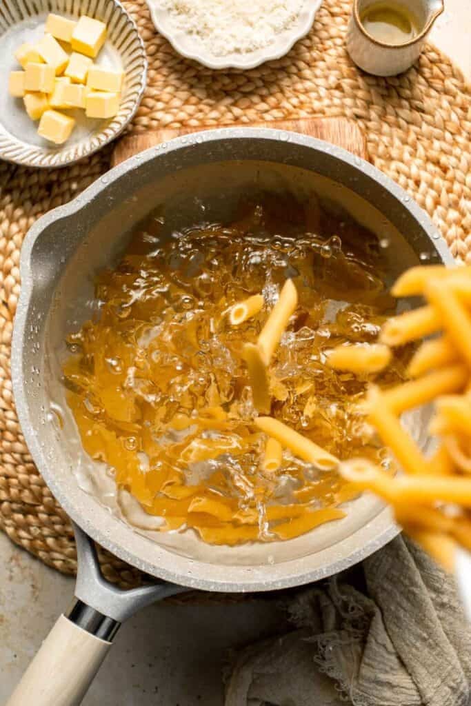 Roasted Brussels Sprouts Pasta is creamy, cozy, and full of caramelized sprouts tossed in a garlic Parmesan sauce. A delicious and easy weeknight dinner. | aheadofthyme.com