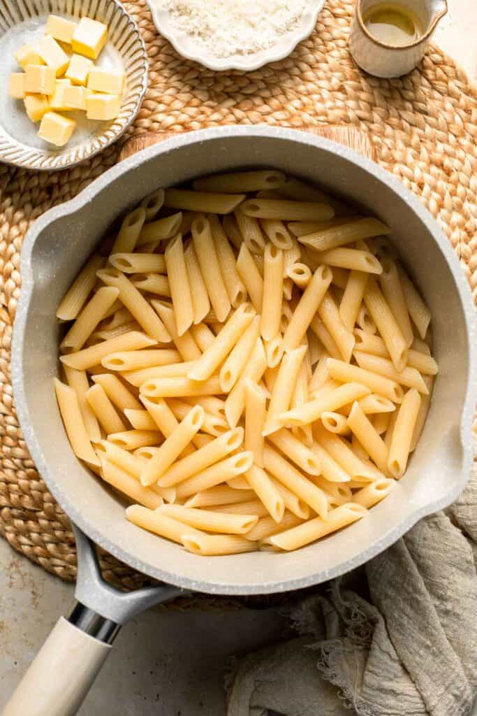 Roasted Brussels Sprouts Pasta is creamy, cozy, and full of caramelized sprouts tossed in a garlic Parmesan sauce. A delicious and easy weeknight dinner. | aheadofthyme.com