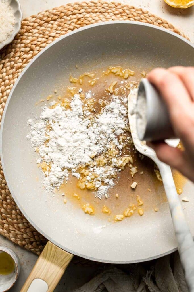 Roasted Brussels Sprouts Pasta is creamy, cozy, and full of caramelized sprouts tossed in a garlic Parmesan sauce. A delicious and easy weeknight dinner. | aheadofthyme.com