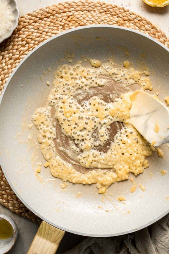 Roasted Brussels Sprouts Pasta is creamy, cozy, and full of caramelized sprouts tossed in a garlic Parmesan sauce. A delicious and easy weeknight dinner. | aheadofthyme.com