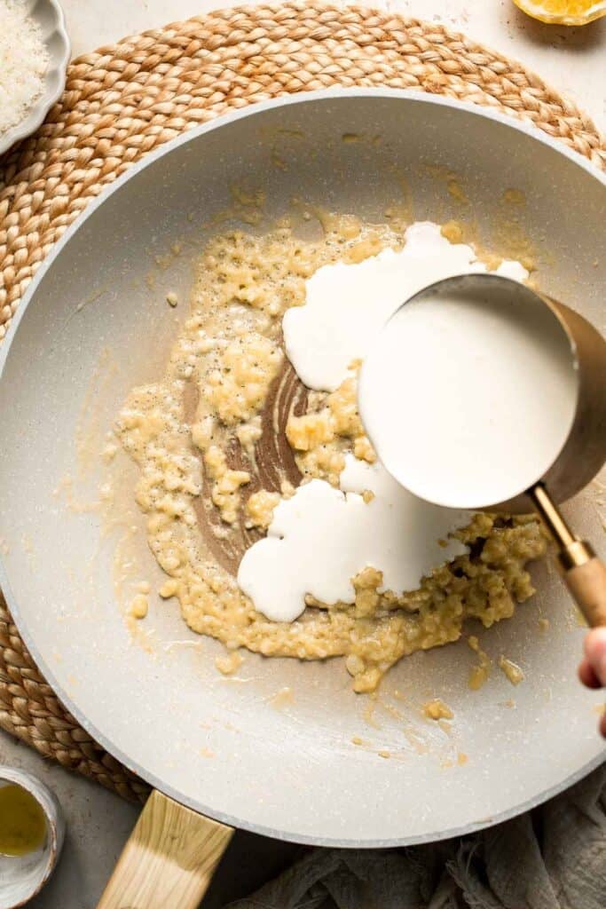 Roasted Brussels Sprouts Pasta is creamy, cozy, and full of caramelized sprouts tossed in a garlic Parmesan sauce. A delicious and easy weeknight dinner. | aheadofthyme.com