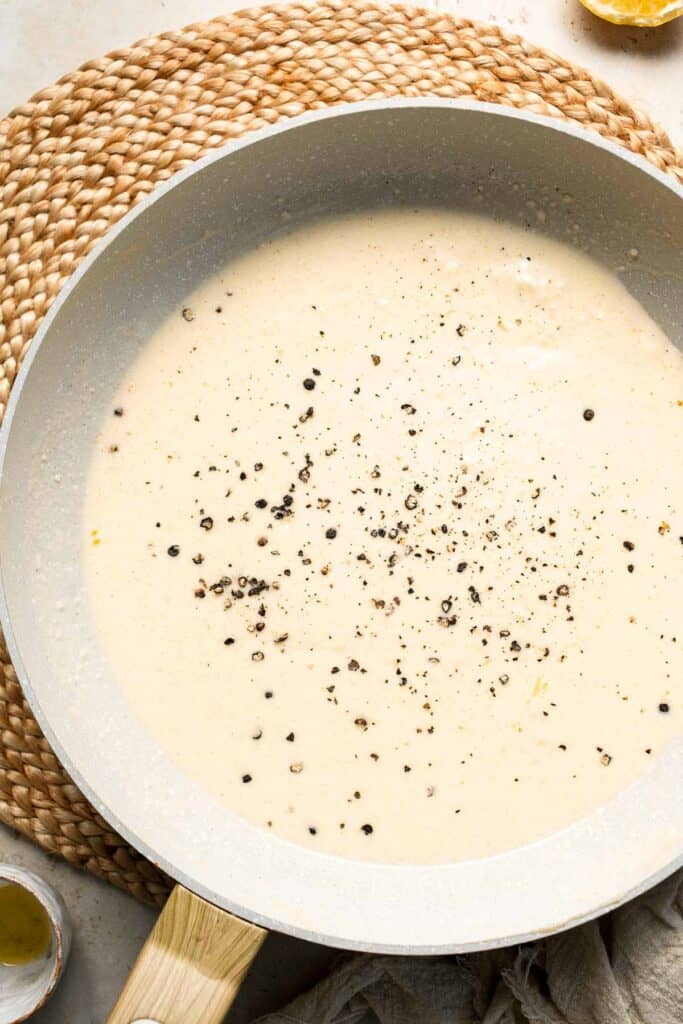 Roasted Brussels Sprouts Pasta is creamy, cozy, and full of caramelized sprouts tossed in a garlic Parmesan sauce. A delicious and easy weeknight dinner. | aheadofthyme.com