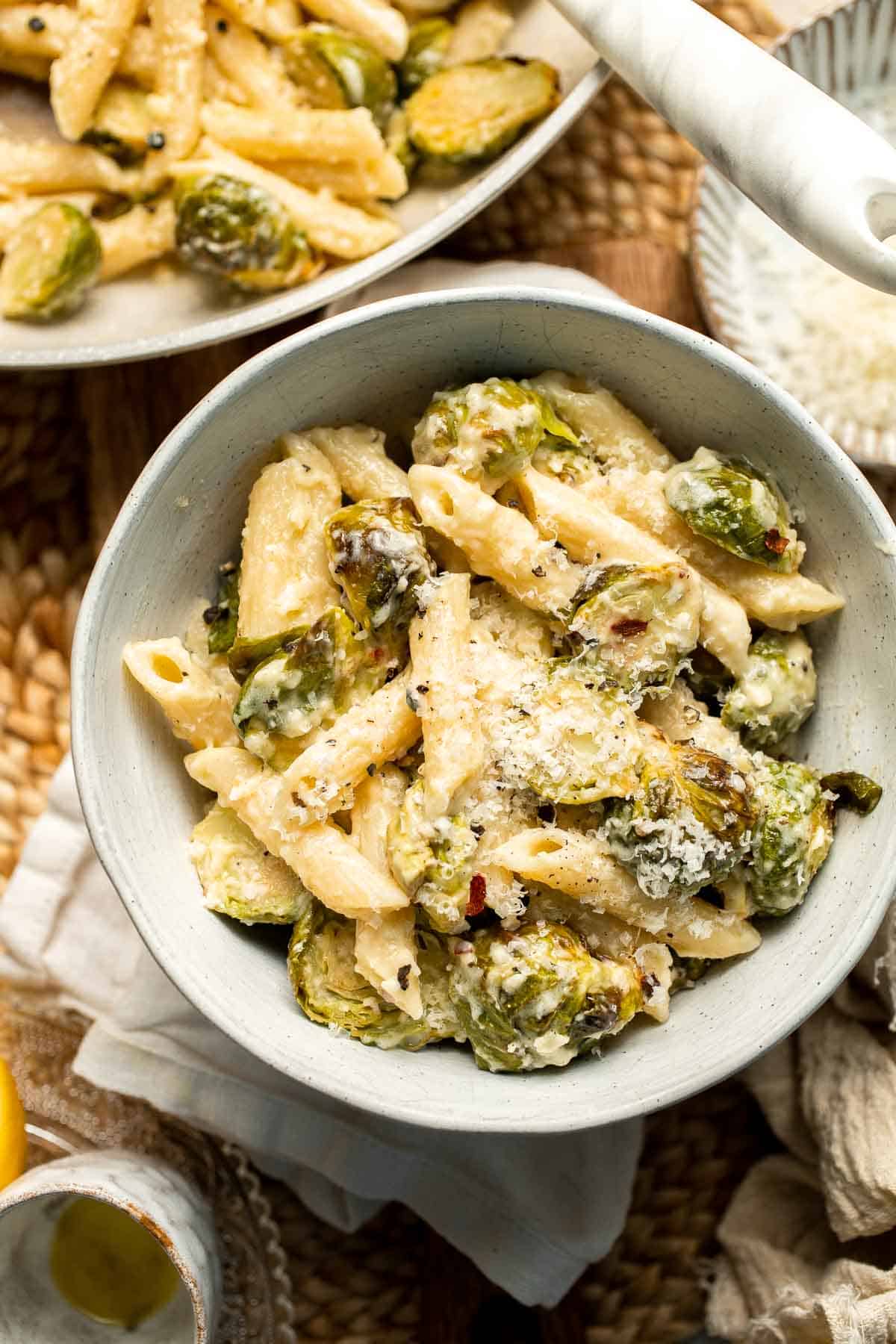 Roasted Brussels Sprouts Pasta is creamy, cozy, and full of caramelized sprouts tossed in a garlic Parmesan sauce. A delicious and easy weeknight dinner. | aheadofthyme.com