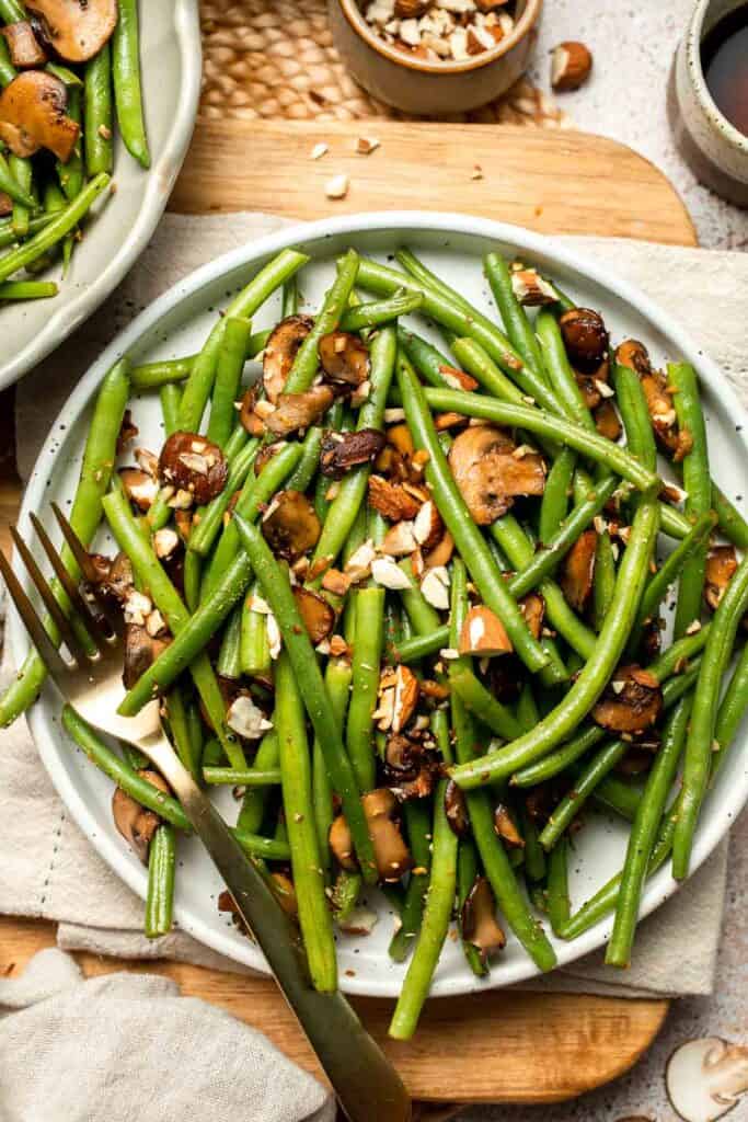 Sautéed Green Beans and Mushrooms are garlicky, buttery, and ready in 25 minutes — a flavorful side dish for any meal. | aheadofthyme.com