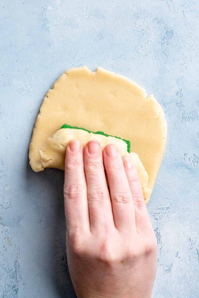 Easy slice and bake Christmas cookies with buttery dough and festive colors, perfect for make ahead holiday baking. | aheadofthyme.com