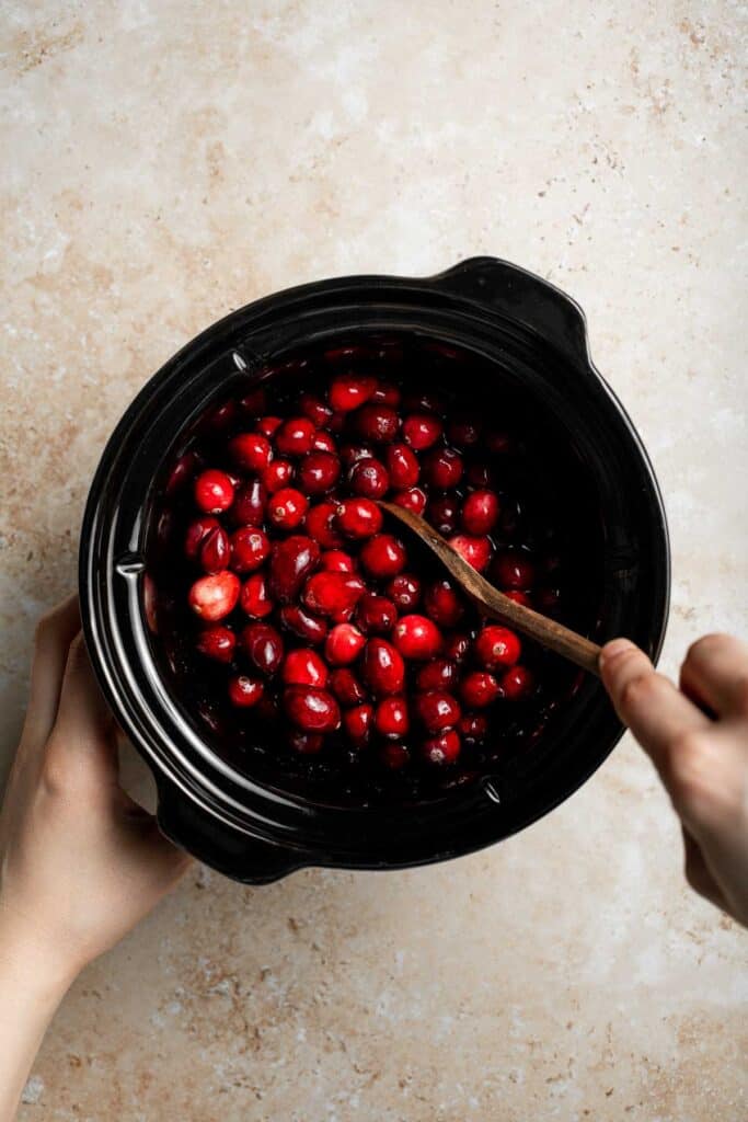 This slow cooker cranberry sauce is sweet, tart, and perfectly spiced. Make this easy cranberry sauce in the crockpot for a stress-free holiday side. | aheadofthyme.com