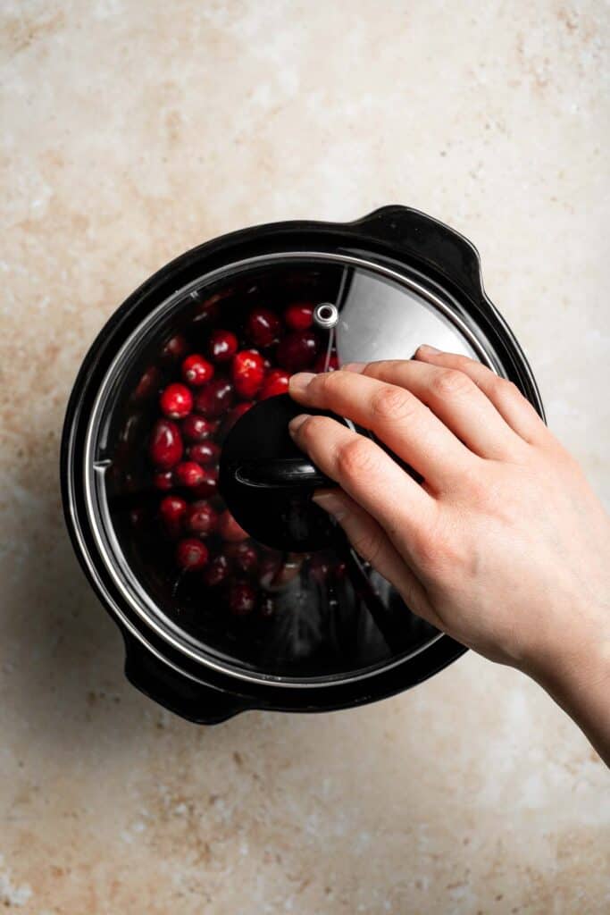 This slow cooker cranberry sauce is sweet, tart, and perfectly spiced. Make this easy cranberry sauce in the crockpot for a stress-free holiday side. | aheadofthyme.com