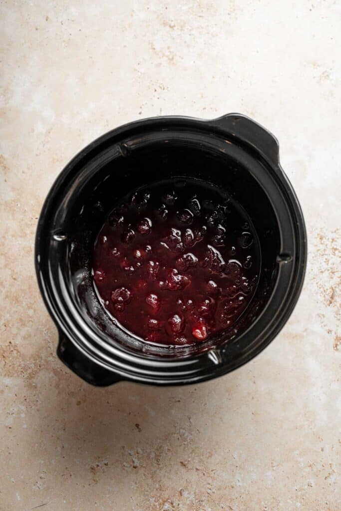 This slow cooker cranberry sauce is sweet, tart, and perfectly spiced. Make this easy cranberry sauce in the crockpot for a stress-free holiday side. | aheadofthyme.com