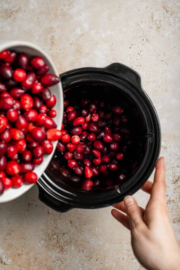 This slow cooker cranberry sauce is sweet, tart, and perfectly spiced. Make this easy cranberry sauce in the crockpot for a stress-free holiday side. | aheadofthyme.com