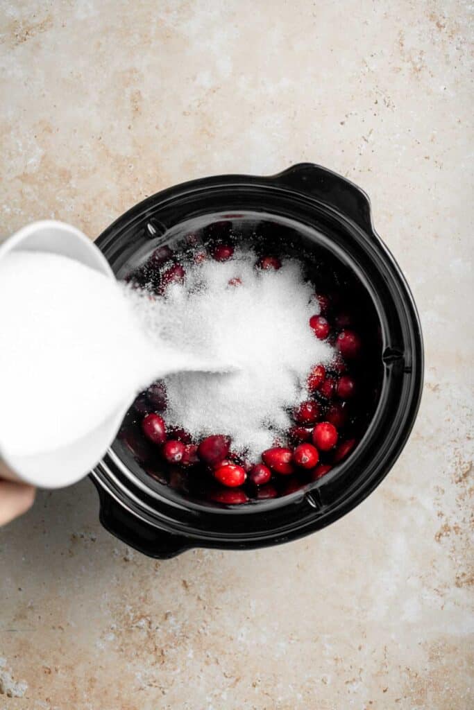 This slow cooker cranberry sauce is sweet, tart, and perfectly spiced. Make this easy cranberry sauce in the crockpot for a stress-free holiday side. | aheadofthyme.com