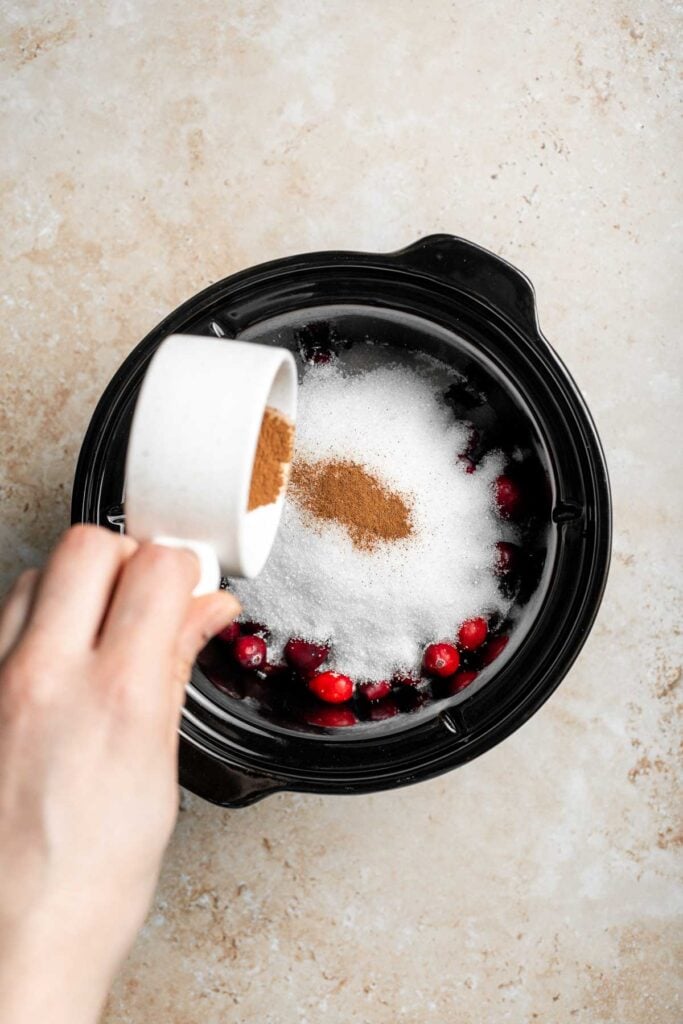 This slow cooker cranberry sauce is sweet, tart, and perfectly spiced. Make this easy cranberry sauce in the crockpot for a stress-free holiday side. | aheadofthyme.com