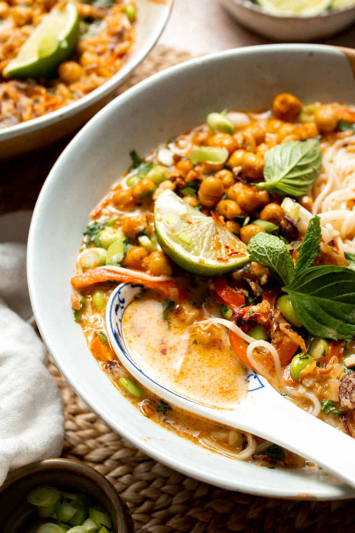 Creamy Thai Coconut Soup with Chickpeas is a cozy, protein-packed vegetarian noodle soup with a rich coconut curry broth and bold flavor. | aheadofthyme.com