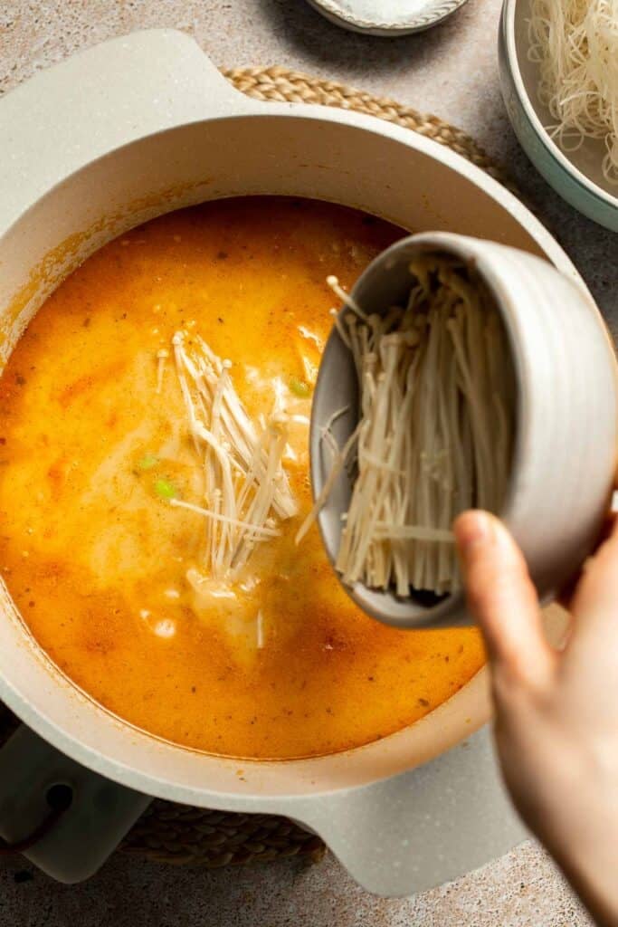 Creamy Thai Coconut Soup with Chickpeas is a cozy, protein-packed vegetarian noodle soup with a rich coconut curry broth and bold flavor. | aheadofthyme.com