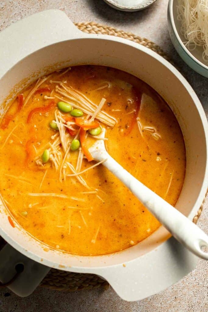 Creamy Thai Coconut Soup with Chickpeas is a cozy, protein-packed vegetarian noodle soup with a rich coconut curry broth and bold flavor. | aheadofthyme.com