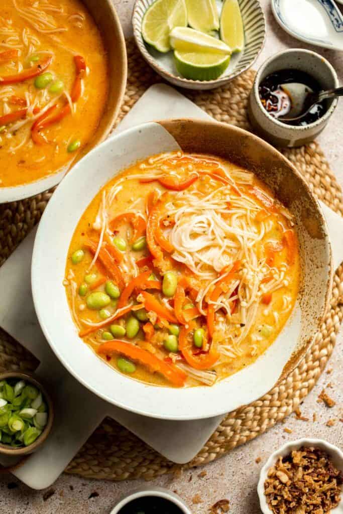 Creamy Thai Coconut Soup with Chickpeas is a cozy, protein-packed vegetarian noodle soup with a rich coconut curry broth and bold flavor. | aheadofthyme.com