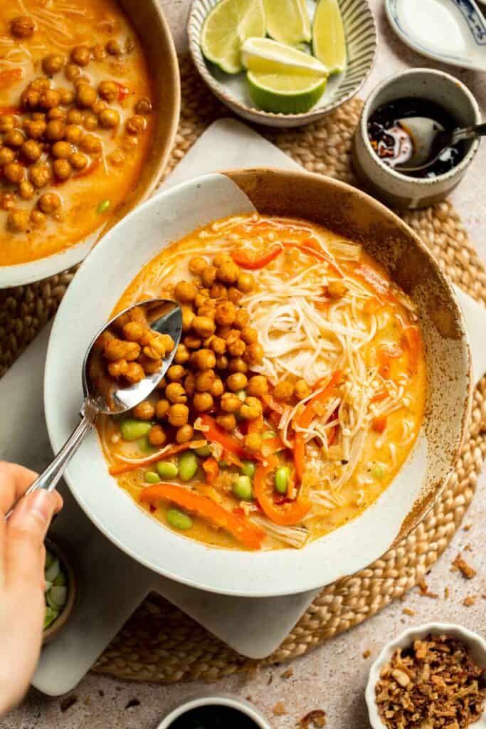 Creamy Thai Coconut Soup with Chickpeas is a cozy, protein-packed vegetarian noodle soup with a rich coconut curry broth and bold flavor. | aheadofthyme.com