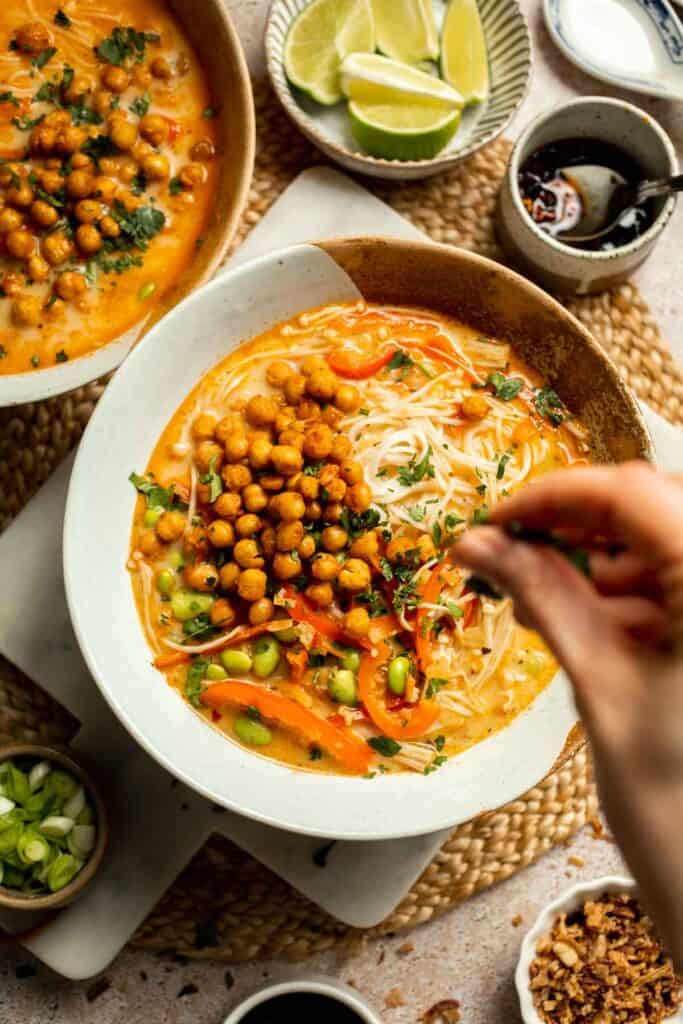 Creamy Thai Coconut Soup with Chickpeas is a cozy, protein-packed vegetarian noodle soup with a rich coconut curry broth and bold flavor. | aheadofthyme.com