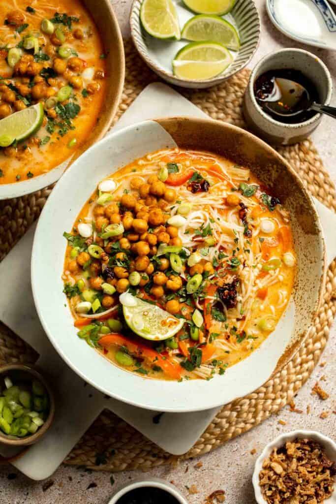 Creamy Thai Coconut Soup with Chickpeas is a cozy, protein-packed vegetarian noodle soup with a rich coconut curry broth and bold flavor. | aheadofthyme.com