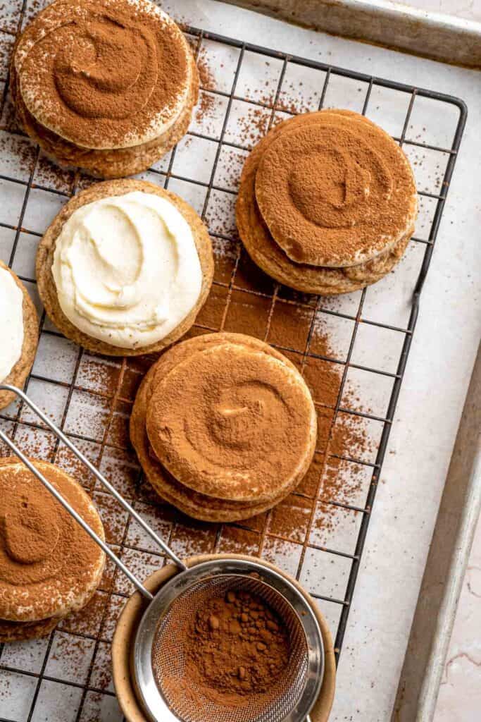 Tiramisu Cookies are soft espresso cookies topped with fluffy mascarpone cream and a dusting of cocoa. Elegant, easy, and perfect for coffee lovers. | aheadofthyme.com