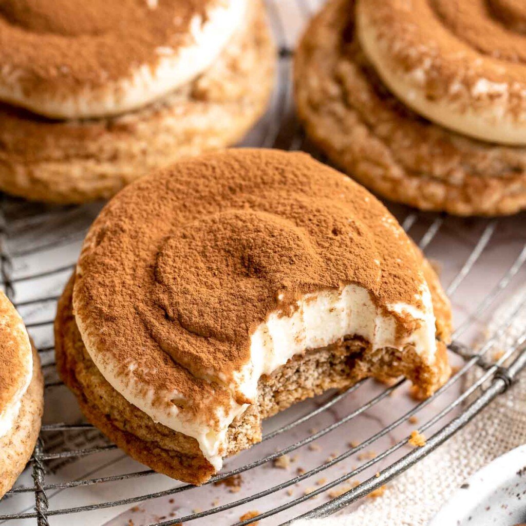 Tiramisu Cookies are soft espresso cookies topped with fluffy mascarpone cream and a dusting of cocoa. Elegant, easy, and perfect for coffee lovers. | aheadofthyme.com