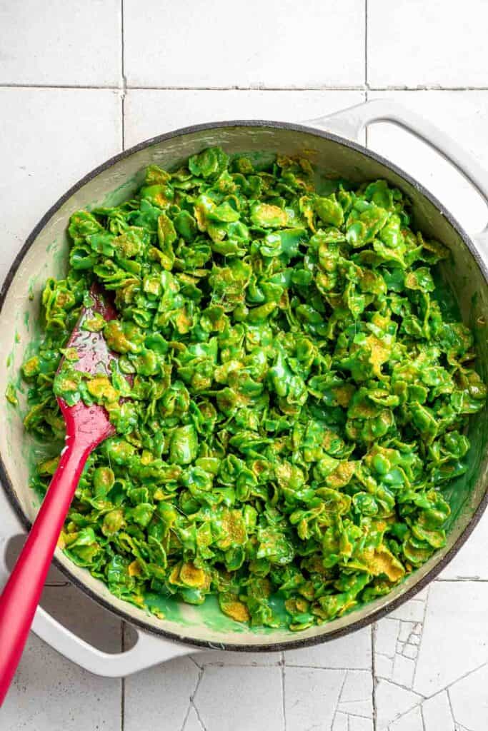 Easy no bake Cornflake Christmas Wreath Cookies made with marshmallows, butter, and green food coloring. They're fun, festive holiday treats everyone loves! | aheadofthyme.com