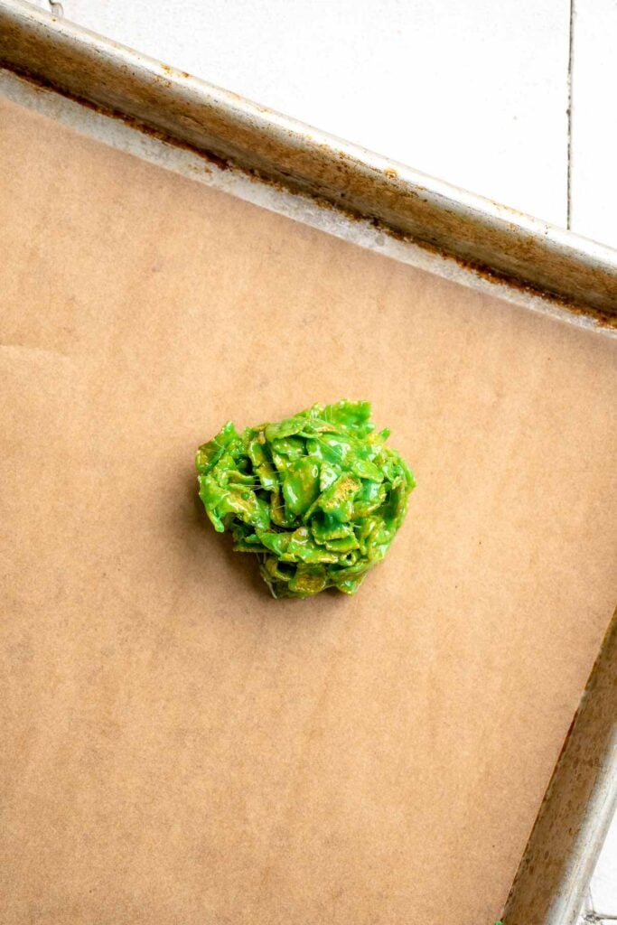 Easy no bake Cornflake Christmas Wreath Cookies made with marshmallows, butter, and green food coloring. They're fun, festive holiday treats everyone loves! | aheadofthyme.com