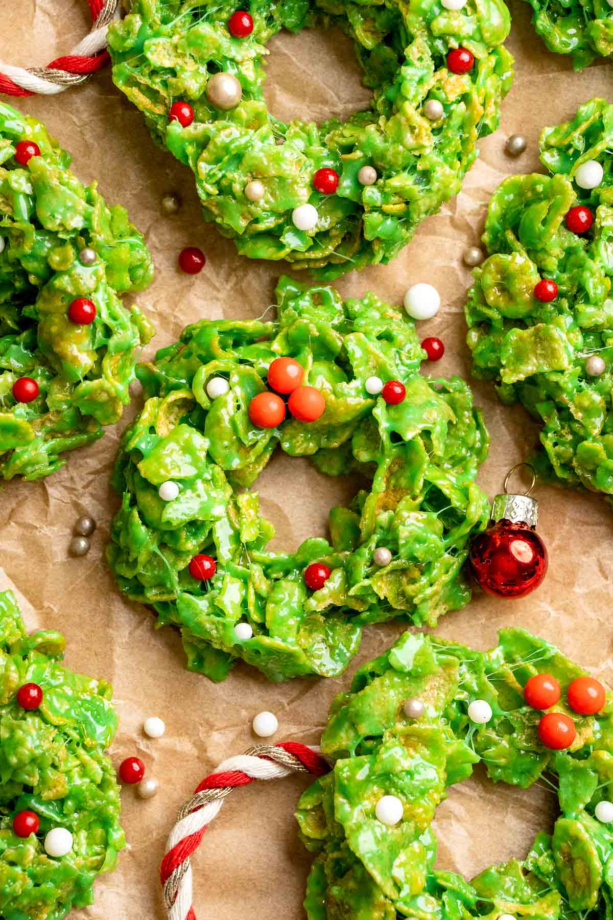 Easy no bake Cornflake Christmas Wreath Cookies made with marshmallows, butter, and green food coloring. They're fun, festive holiday treats everyone loves! | aheadofthyme.com