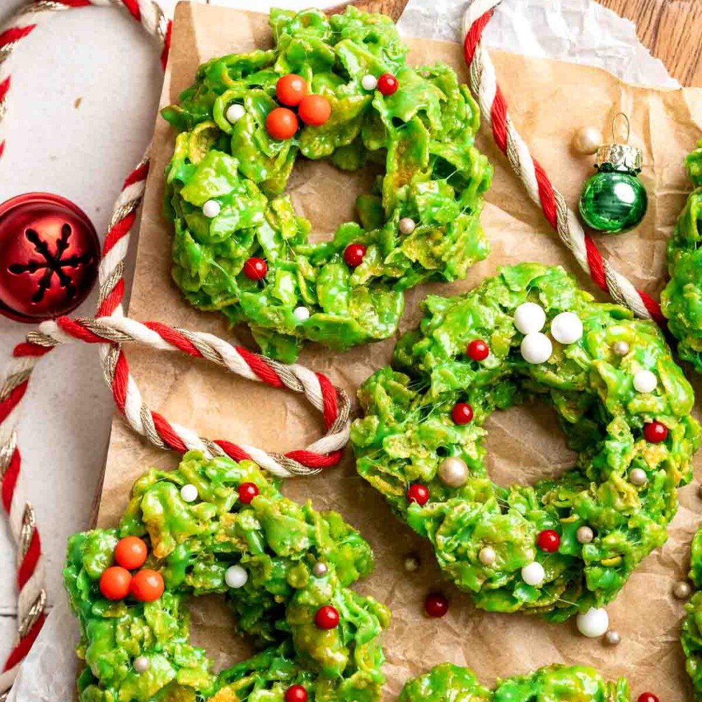 Easy no bake Cornflake Christmas Wreath Cookies made with marshmallows, butter, and green food coloring. They're fun, festive holiday treats everyone loves! | aheadofthyme.com