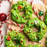 Easy no bake Cornflake Christmas Wreath Cookies made with marshmallows, butter, and green food coloring. They're fun, festive holiday treats everyone loves! | aheadofthyme.com