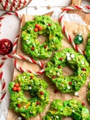 Easy no bake Cornflake Christmas Wreath Cookies made with marshmallows, butter, and green food coloring. They're fun, festive holiday treats everyone loves! | aheadofthyme.com