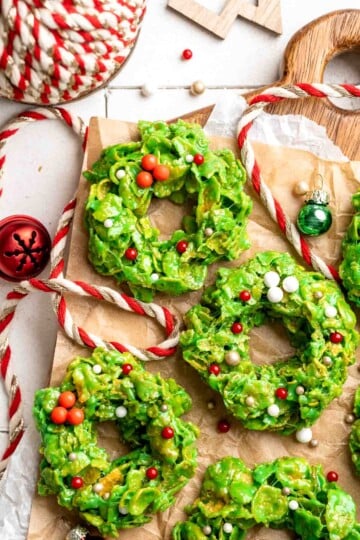 Easy no bake Cornflake Christmas Wreath Cookies made with marshmallows, butter, and green food coloring. They're fun, festive holiday treats everyone loves! | aheadofthyme.com