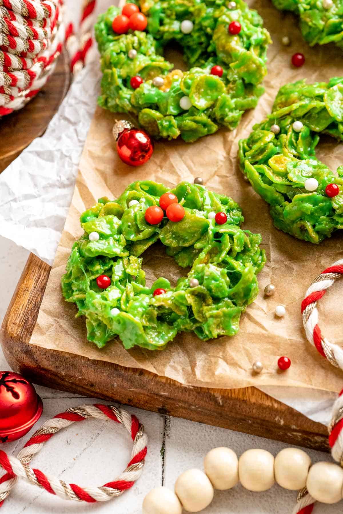 Easy no bake Cornflake Christmas Wreath Cookies made with marshmallows, butter, and green food coloring. They're fun, festive holiday treats everyone loves! | aheadofthyme.com