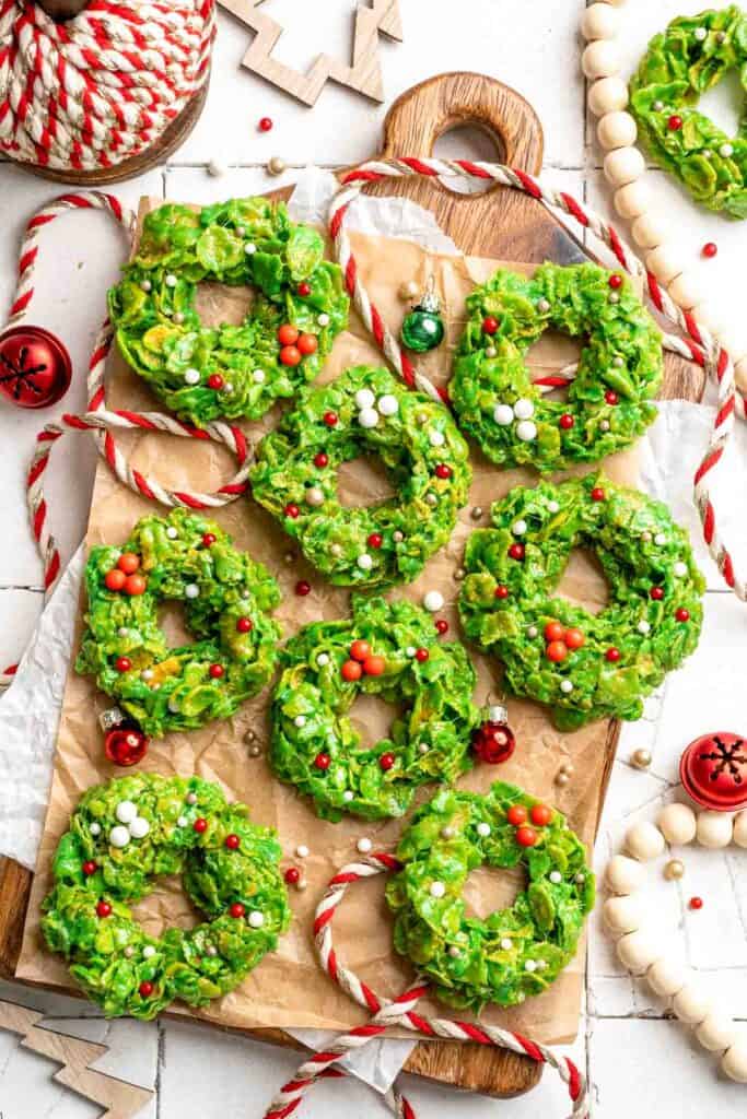 Easy no bake Cornflake Christmas Wreath Cookies made with marshmallows, butter, and green food coloring. They're fun, festive holiday treats everyone loves! | aheadofthyme.com