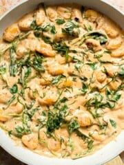 This creamy Tuscan gnocchi is a quick one pan dinner with sun dried tomatoes, spinach, garlic, and Parmesan. | aheadofthyme.com