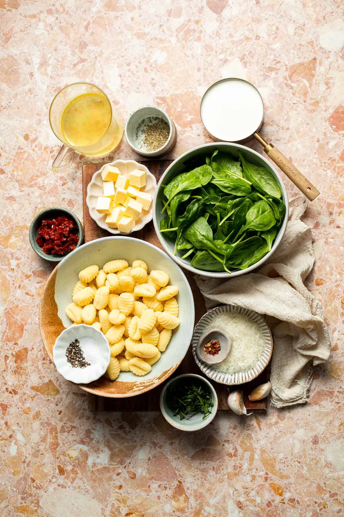 This creamy Tuscan gnocchi is a quick one pan dinner with sun dried tomatoes, spinach, garlic, and Parmesan. | aheadofthyme.com