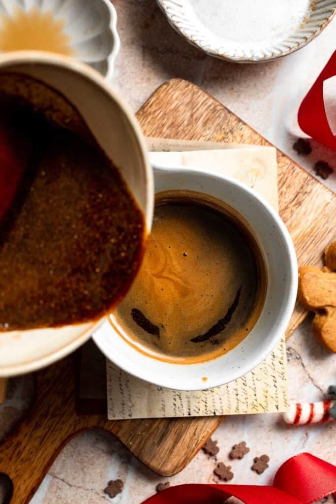 Cozy homemade gingerbread latte recipe made with homemade gingerbread syrup, espresso, warm spices, and steamed milk. | aheadofthyme.com