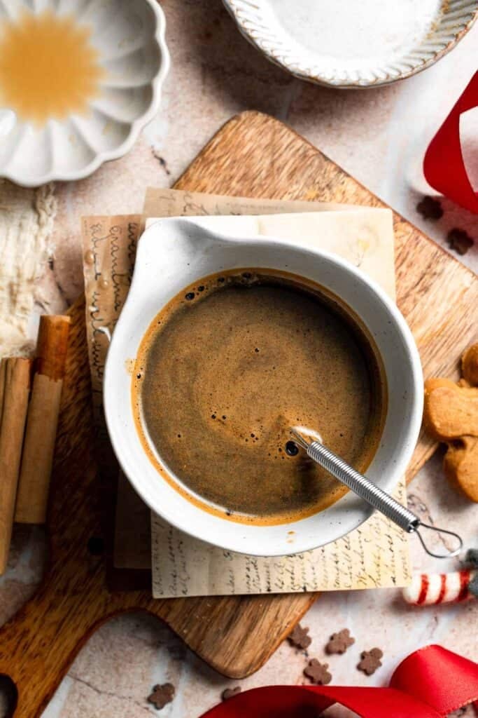 Cozy homemade gingerbread latte recipe made with homemade gingerbread syrup, espresso, warm spices, and steamed milk. | aheadofthyme.com