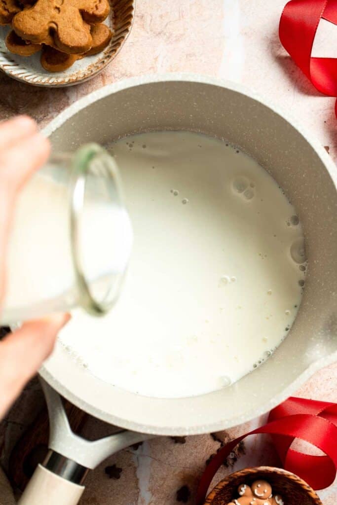 Cozy homemade gingerbread latte recipe made with homemade gingerbread syrup, espresso, warm spices, and steamed milk. | aheadofthyme.com