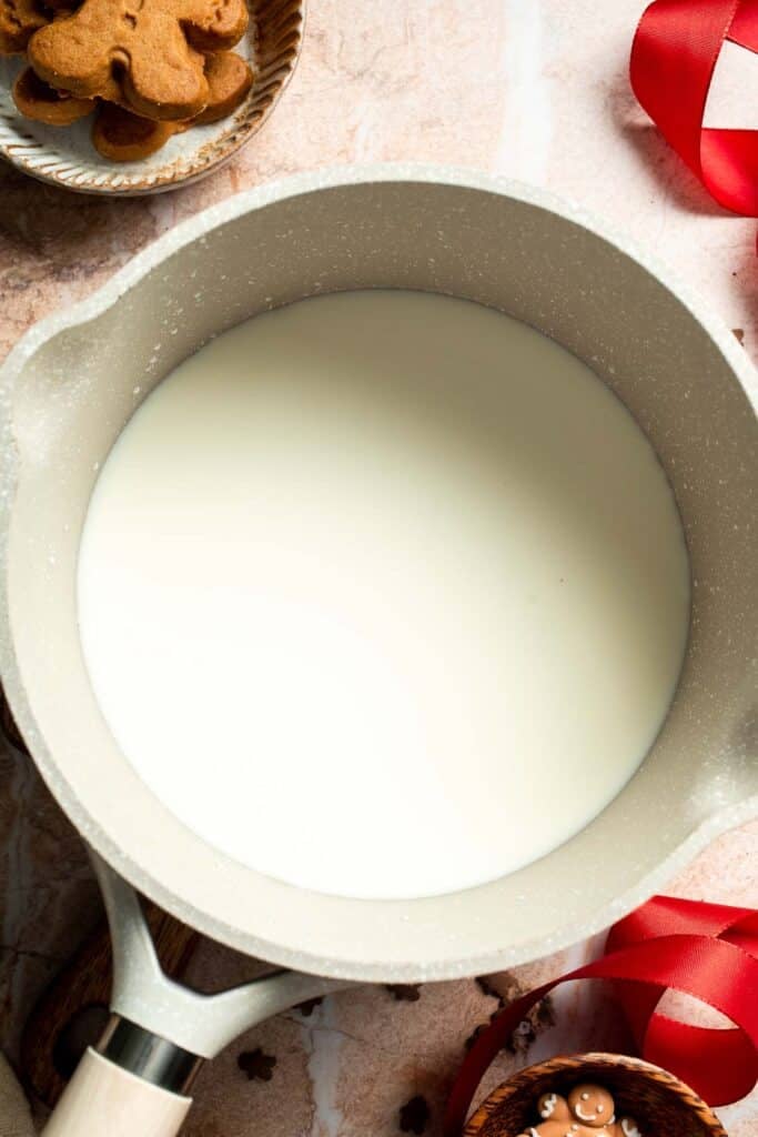 Cozy homemade gingerbread latte recipe made with homemade gingerbread syrup, espresso, warm spices, and steamed milk. | aheadofthyme.com