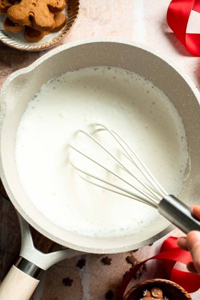 Cozy homemade gingerbread latte recipe made with homemade gingerbread syrup, espresso, warm spices, and steamed milk. | aheadofthyme.com