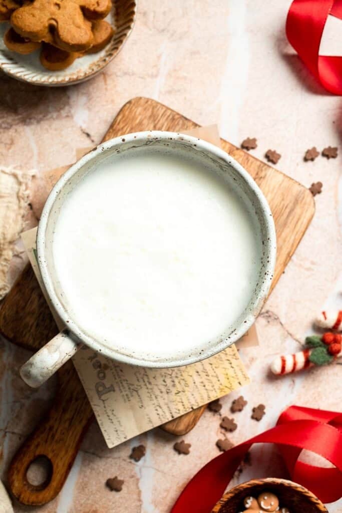 Cozy homemade gingerbread latte recipe made with homemade gingerbread syrup, espresso, warm spices, and steamed milk. | aheadofthyme.com