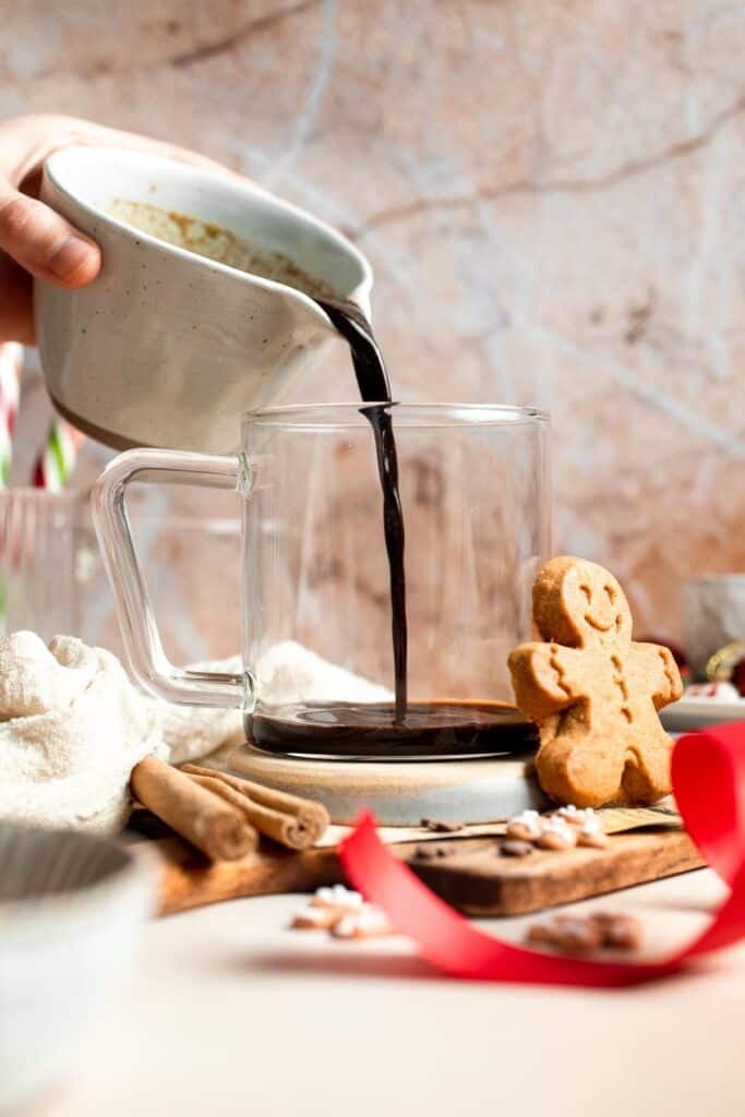 Cozy homemade gingerbread latte recipe made with homemade gingerbread syrup, espresso, warm spices, and steamed milk. | aheadofthyme.com