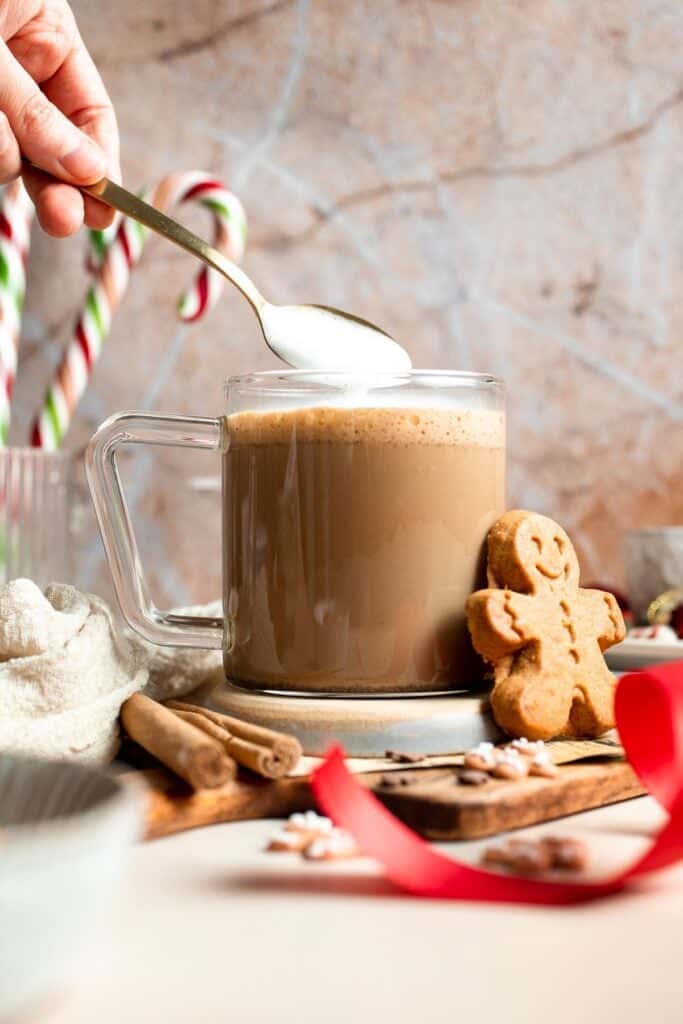 Cozy homemade gingerbread latte recipe made with homemade gingerbread syrup, espresso, warm spices, and steamed milk. | aheadofthyme.com