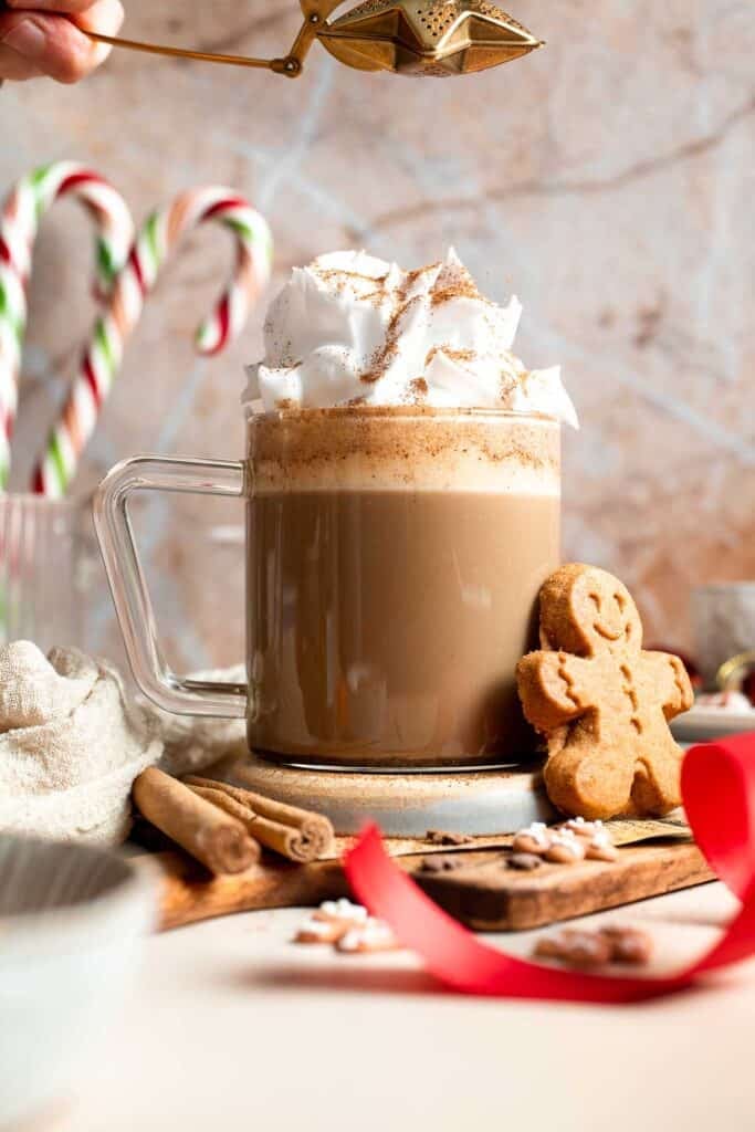 Cozy homemade gingerbread latte recipe made with homemade gingerbread syrup, espresso, warm spices, and steamed milk. | aheadofthyme.com