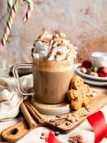 Cozy homemade gingerbread latte recipe made with homemade gingerbread syrup, espresso, warm spices, and steamed milk. | aheadofthyme.com